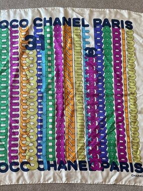 Chanel Rainbow Silk scarf featuring a graphic "Coco Chanel Paris" print